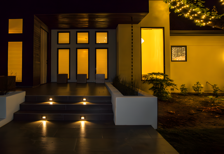 Front entrance at night with accent lighting